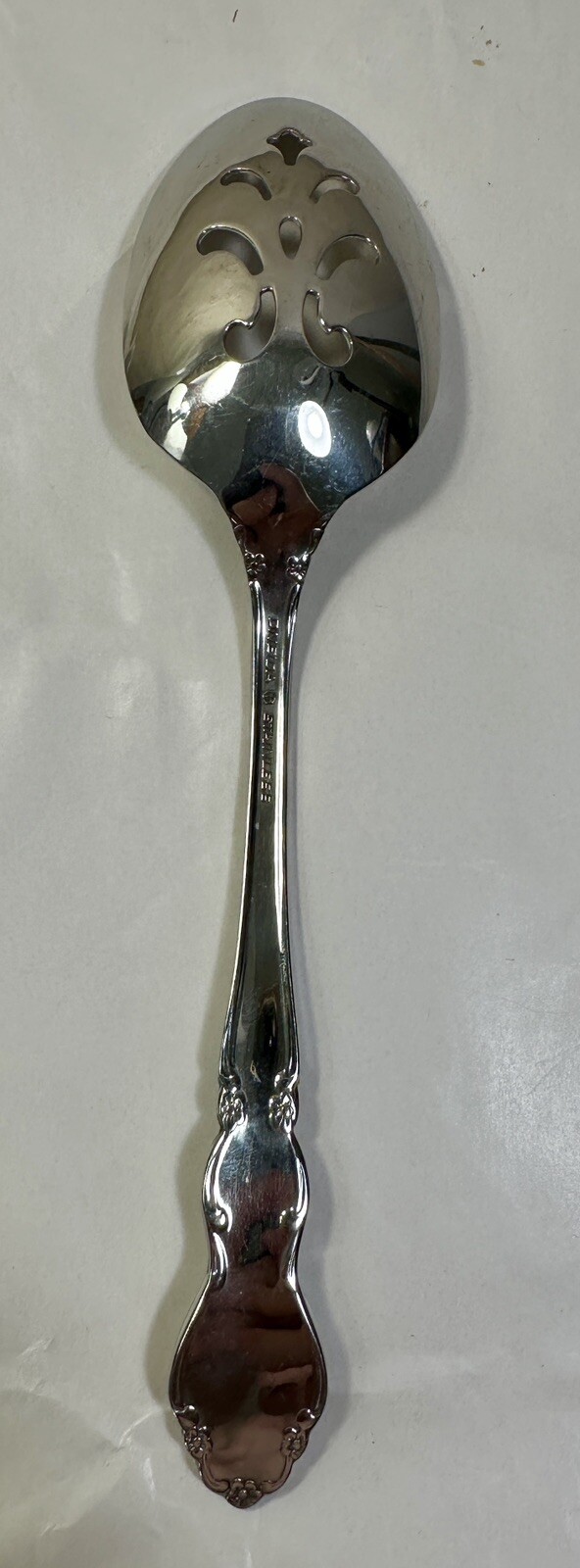 One Oneida Dover Stainless Pierced Tablespoon (Serving Spoon) - 8 3/8" - Image 1